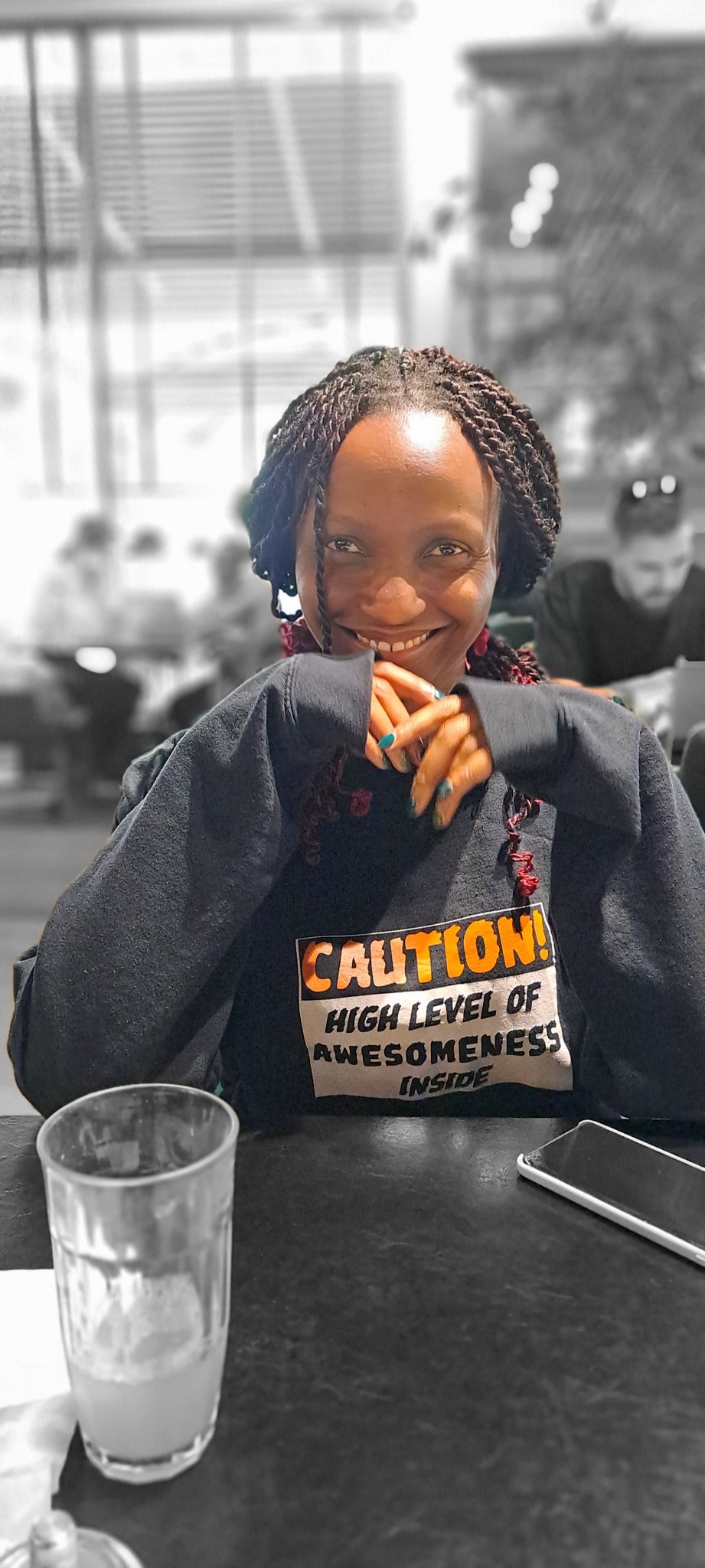 Bilha smiling at a table